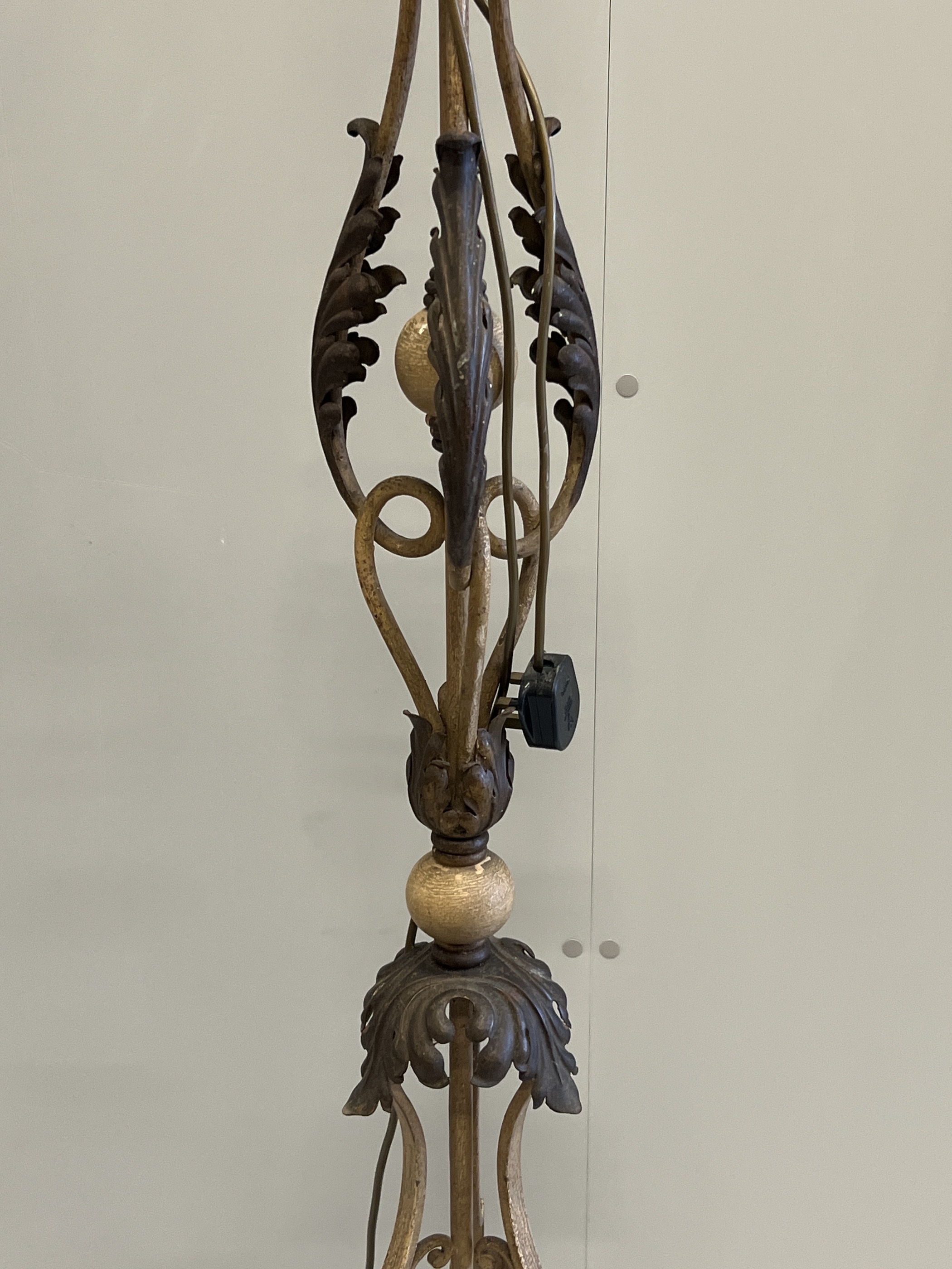 An early 20th century French wrought iron telescopic standard lamp